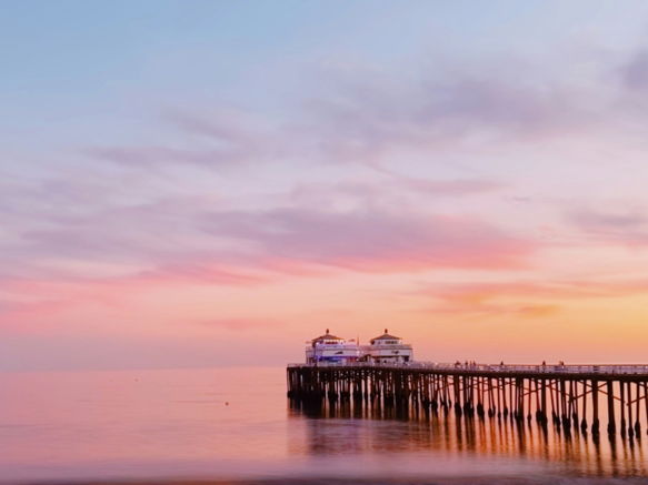 a pier that is next to a body of water