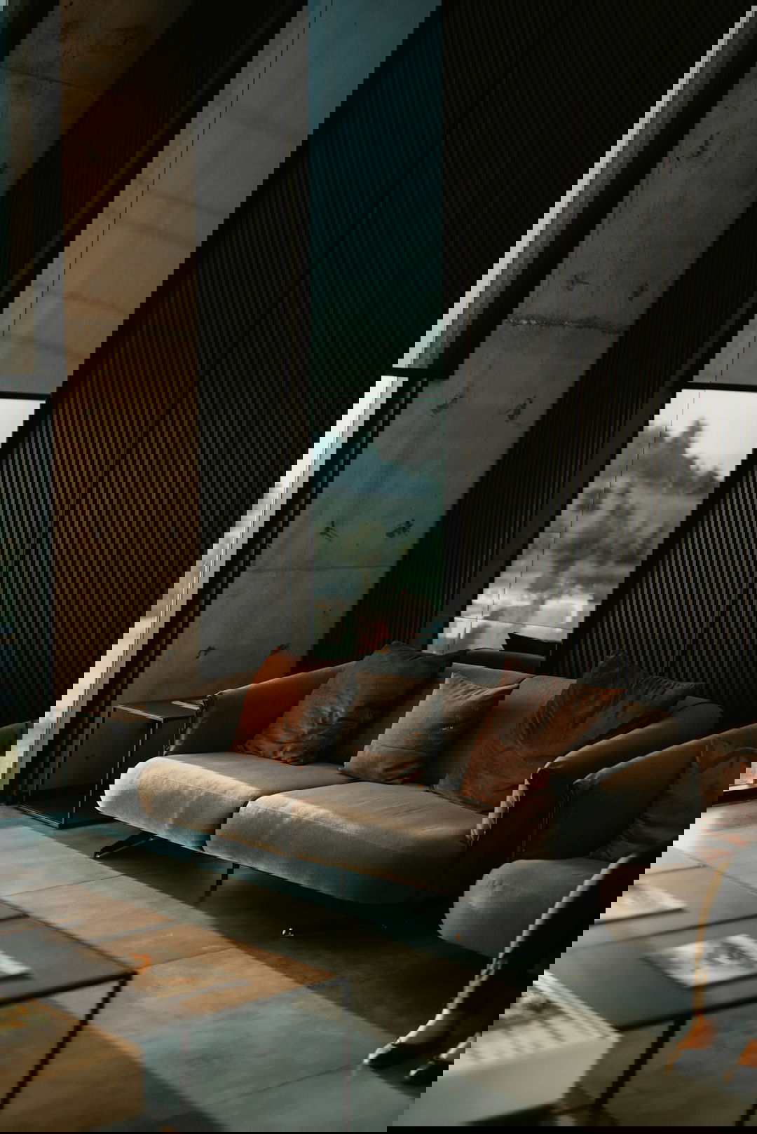 brown and white couch beside window
